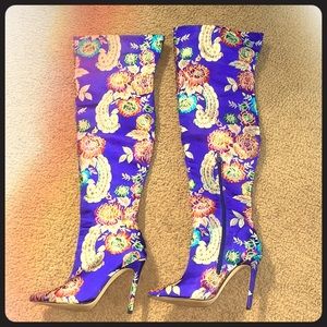 Blue silk “Privileged” boots.